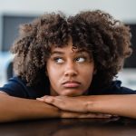 bored woman with her head on her hands