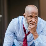 concerned black businessman in city