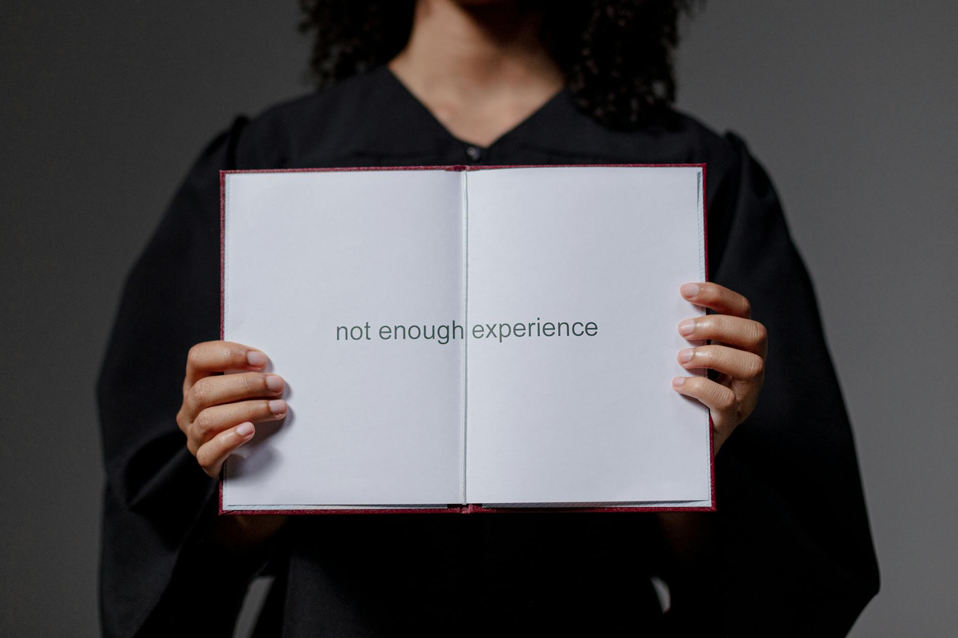woman holding certificate with not enough experience